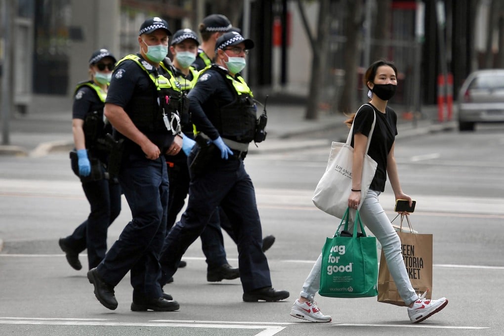 Police officers patrol through the streets of Melbourne on Wednesday. Photo: AFP
