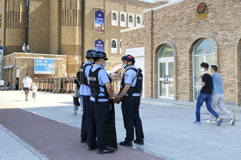 Police officers near the International Grand Bazaar in Urumqi in China’s Xinjiang Uygur autonomous region in July. Photo: Kyodo