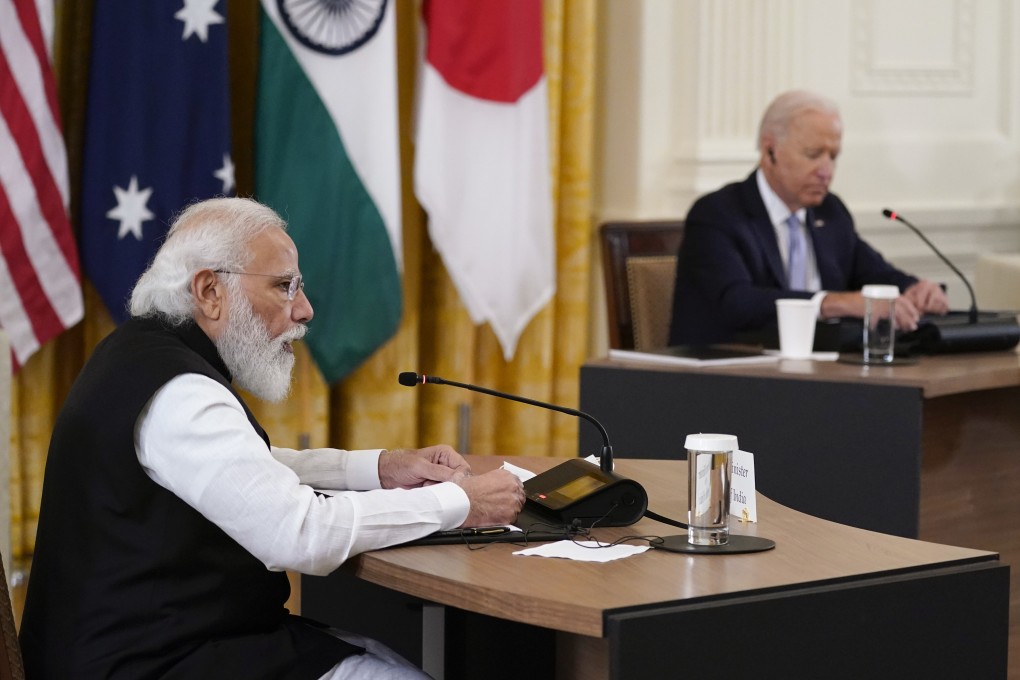 Indian Prime Minister Narendra Modi, left, speaks during the Quad summit with President Joe Biden, right, as well as Australian Prime Minister Scott Morrison and Japanese Prime Minister Yoshihide Suga, in the East Room of the White House, on September 24 in Washington. Photo: AP Photo