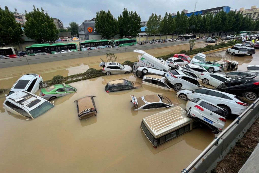 Cars submerged in floodwaters after heavy rains hit the city of Zhengzhou in China’s central Henan province. Photo: AFP