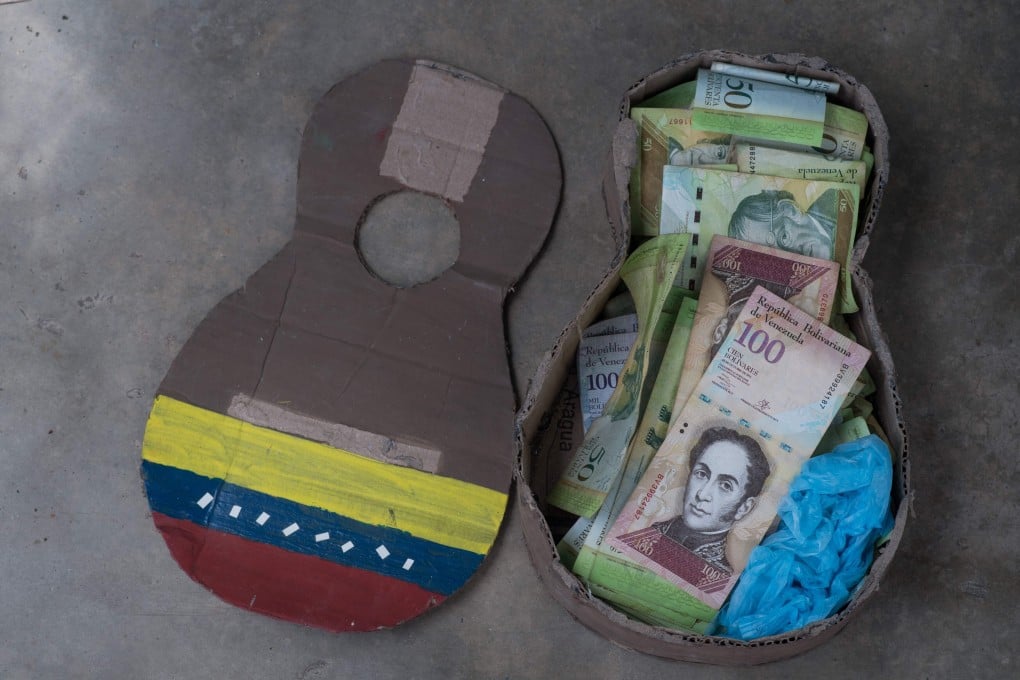A Venezuelan instrument made of cardboard is used to store unused Venezuelan bolivar bills in Puerto Concha town, Zulia state, Venezuela. Photo: AFP