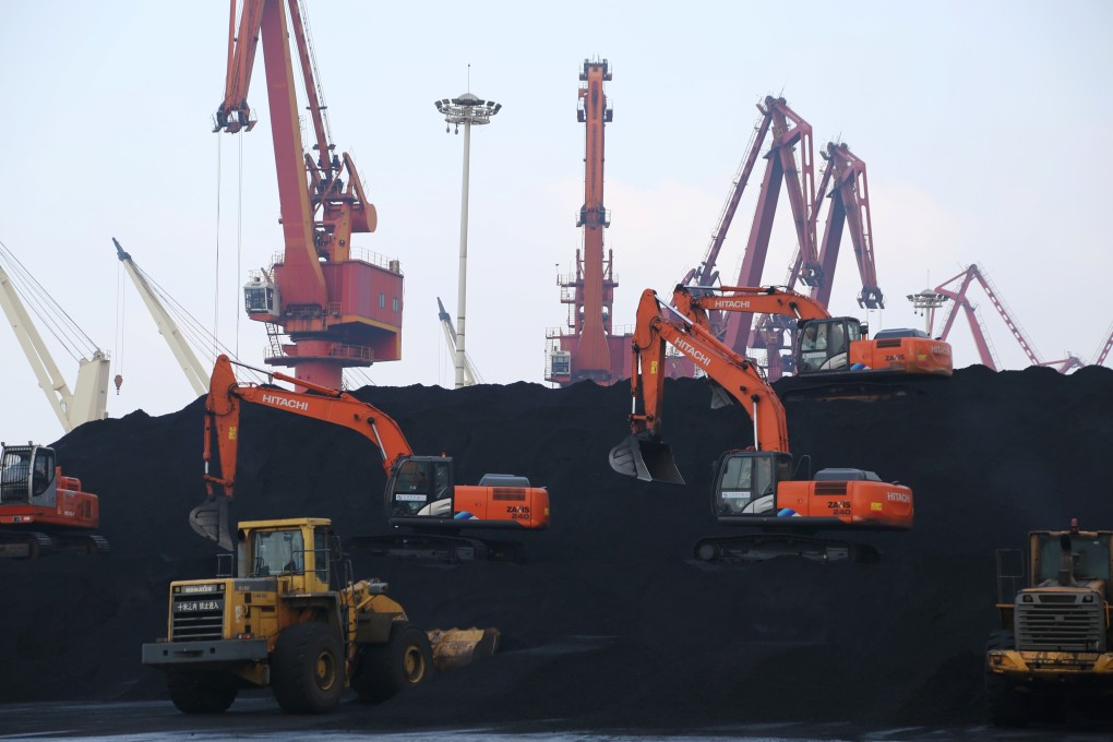 Workers unload imported coal at a port in Jiangsu province, China. File photo: Reuters