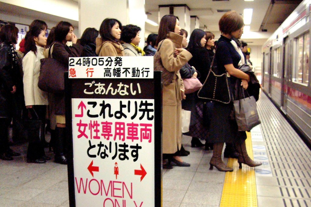 Female passengers in Tokyo queue for a "Women Only" carriage before the pandemic. Over the years many women have been groped by men and the taking of illicit photographs – upskirting –is on the rise. Photo: AFP