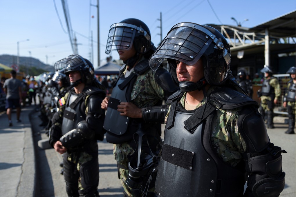 Members of the military stand guard outside the Penitenciaria del Litoral in Guayaquil, Ecuador on Thursday. Photo: Reuters