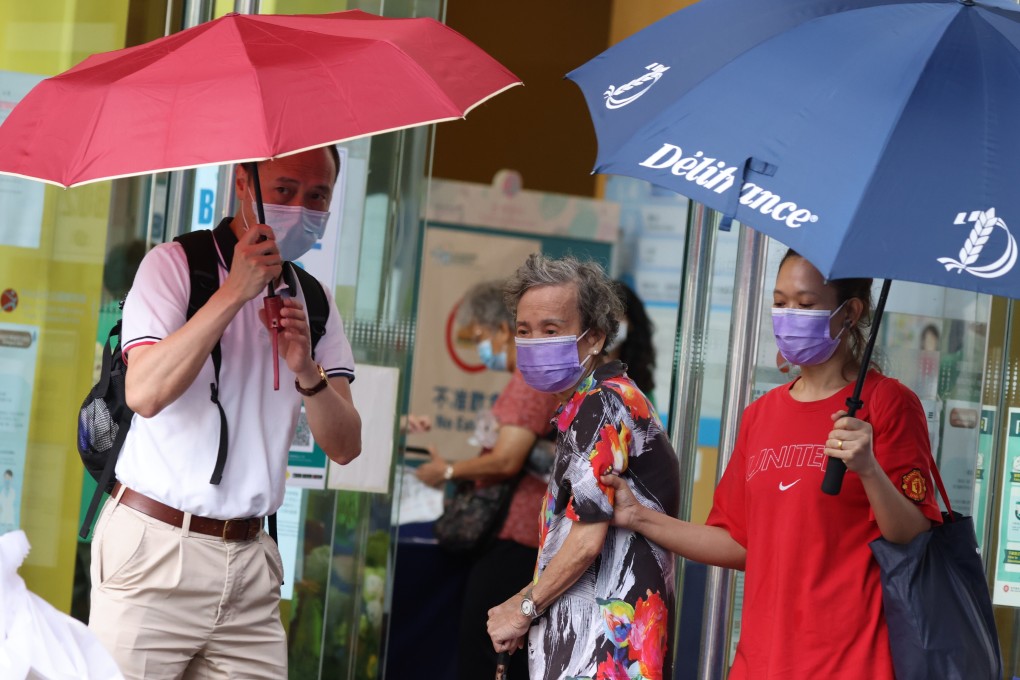 An elderly resident arrives for a coronavirus vaccination last month at Sun Yat Sen Memorial Park Sports Centre. Photo: Nora Tam