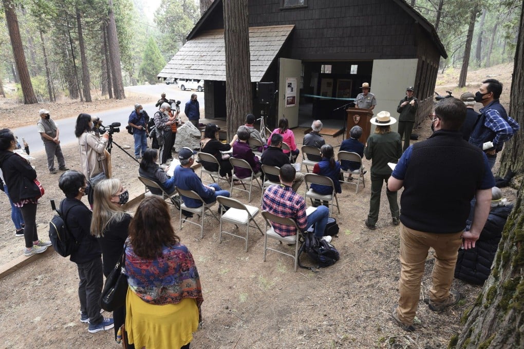Officials speak during the dedication of the 1917 Chinese Laundry Building at Wawona in Yosemite National Park, California. A new sign and exhibit were unveiled, formally recognising Chinese-Americans' contributions to the national park's history. Photo: The Fresno Bee/AP