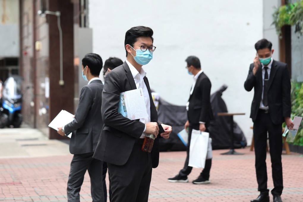 Sales agents outside the sales office of China Evergrande Grouup at the Billion Plaza II in Lai Chi Kok on April 18, 2020. The developer’s inaugural housing project in Hong Kong’s Tuen Mun area flopped after an initial buzz during its launch. Photo: Xiaomei Chen