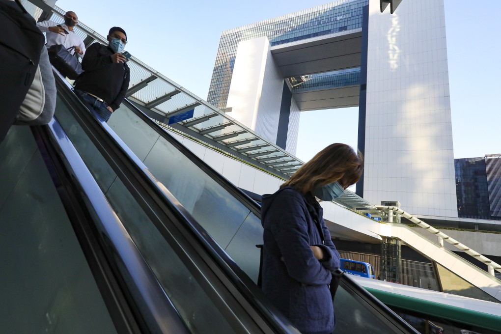 People pass the government’s headquarters in Admiralty. Chief Executive Carrie Lam has proposed the biggest government restructuring in more than a decade. Photo: Nora Tam