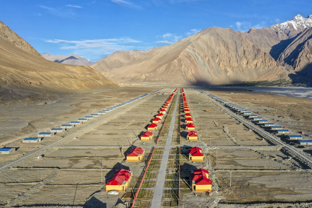 China’s “pairing assistance” programme has helped lift people out of poverty in the Xinjiang Uygur autonomous region, such as through the construction of new resettlement housing sites (above), but it also has resulted in “ghost cities”. Photo: Xinhua