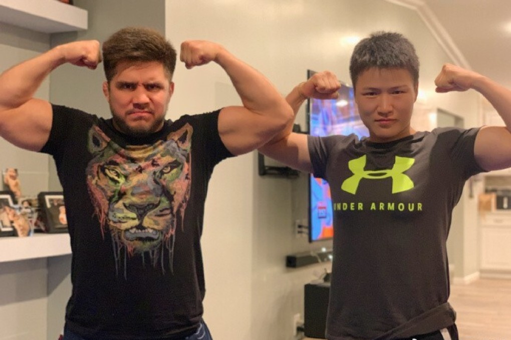 Former UFC strawweight champion Zhang Weili (right) poses for a photo with Henry Cejudo at his home in Arizona. Photo: Weibo/Zhang Weili
