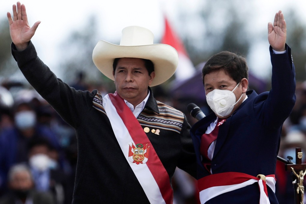Peru's President Pedro Castillo (left) and newly named Prime Minister Guido Bellido gesture during an event at the Pampas de Ayacucho Historic Sanctuary in July. Photo: Reuters