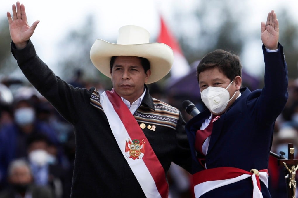 Peru's President Pedro Castillo (left) and newly named Prime Minister Guido Bellido gesture during an event at the Pampas de Ayacucho Historic Sanctuary in July. Photo: Reuters