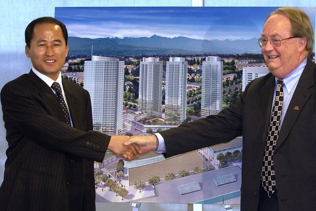 South Korean developer Jung Myung-soo is seen at the unveiling of his plans for the Central City project in Surrey, British Columbia, in 2005, with Surrey’s mayor, Doug McCallum. At the time it was to be the biggest residential and retail development in Surrey‘s history. Photo: Material republished with the express permission of Vancouver Province, a division of Postmedia Network Inc