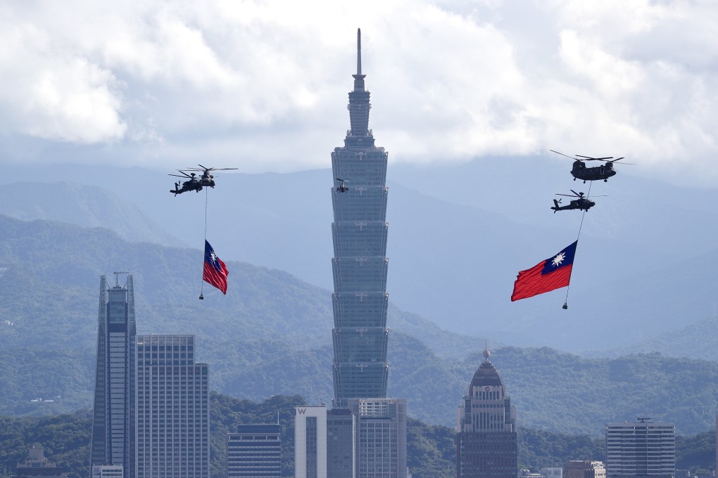 Taiwanese military helicopters carry Taiwan flags over Taipei, but flights close to the island by PLA planes raise the question of whether an invasion is planned. Photo: EPA-EFE
