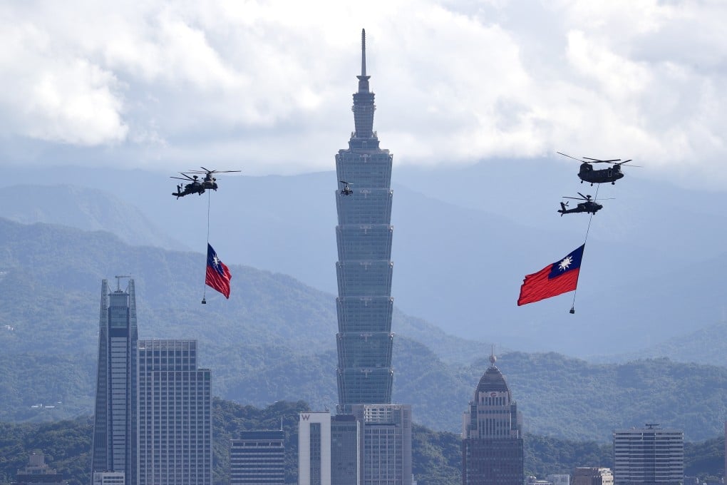 Taiwanese military helicopters carry Taiwan flags over Taipei, but flights close to the island by PLA planes raise the question of whether an invasion is planned. Photo: EPA-EFE