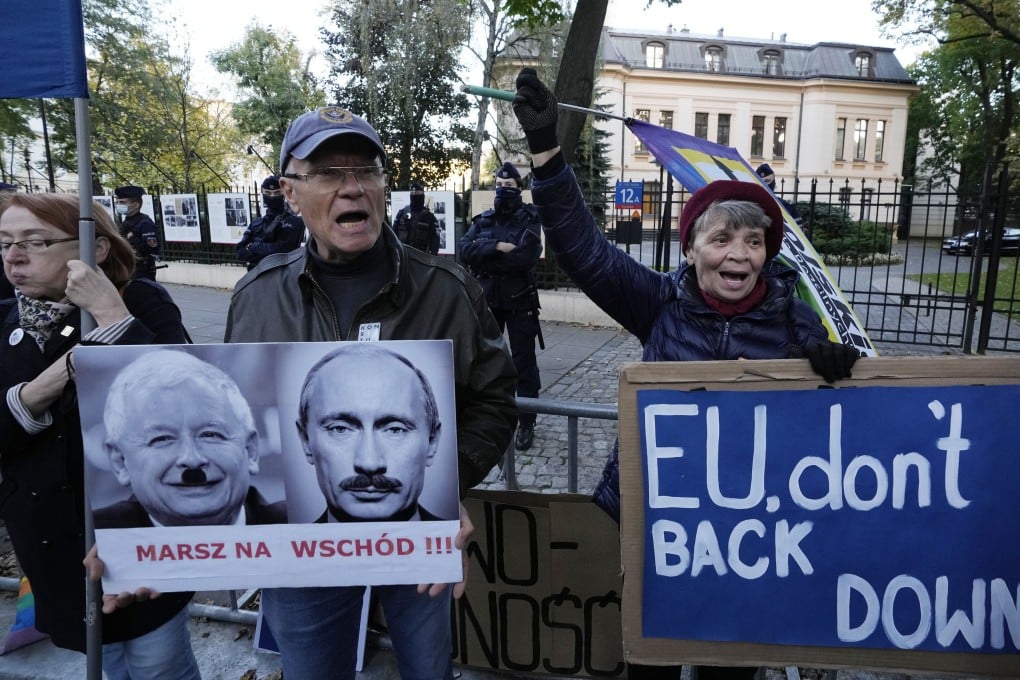 People stage a protest in front of Poland's constitutional court, in Warsaw, Poland. Some 80 per cent of Poles support EU membership. Photo: AP