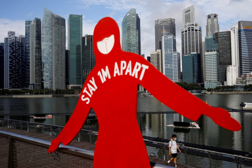 A sign to encourage social distancing in Singapore. Photo: Reuters