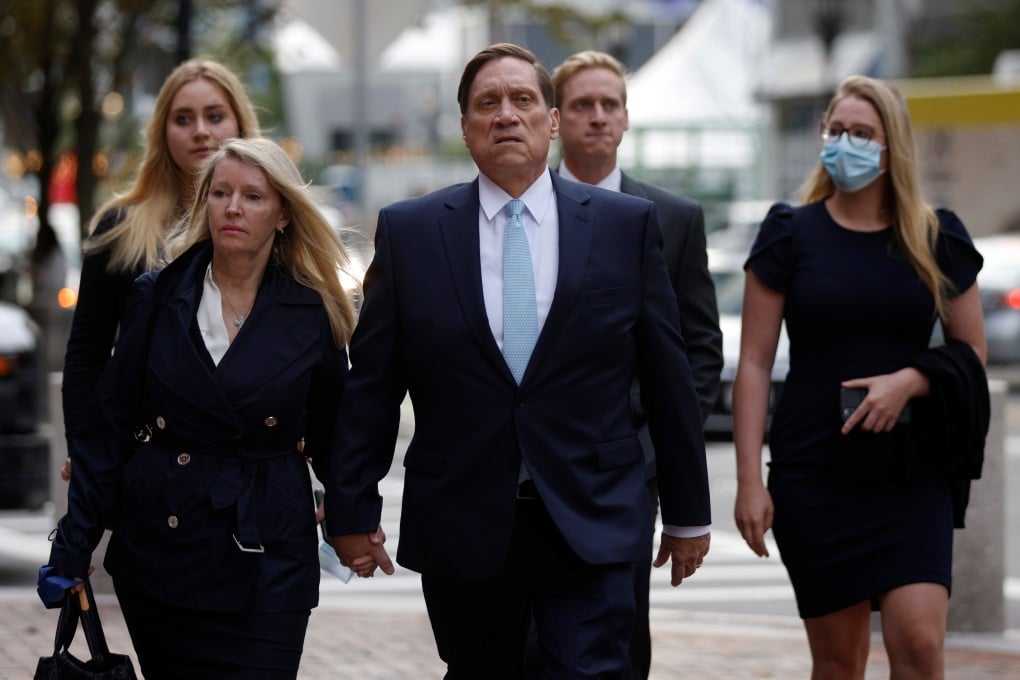 Private equity firm founder John B. Wilson (centre) arrives at federal court in Boston on Wednesday. Photo: Reuters