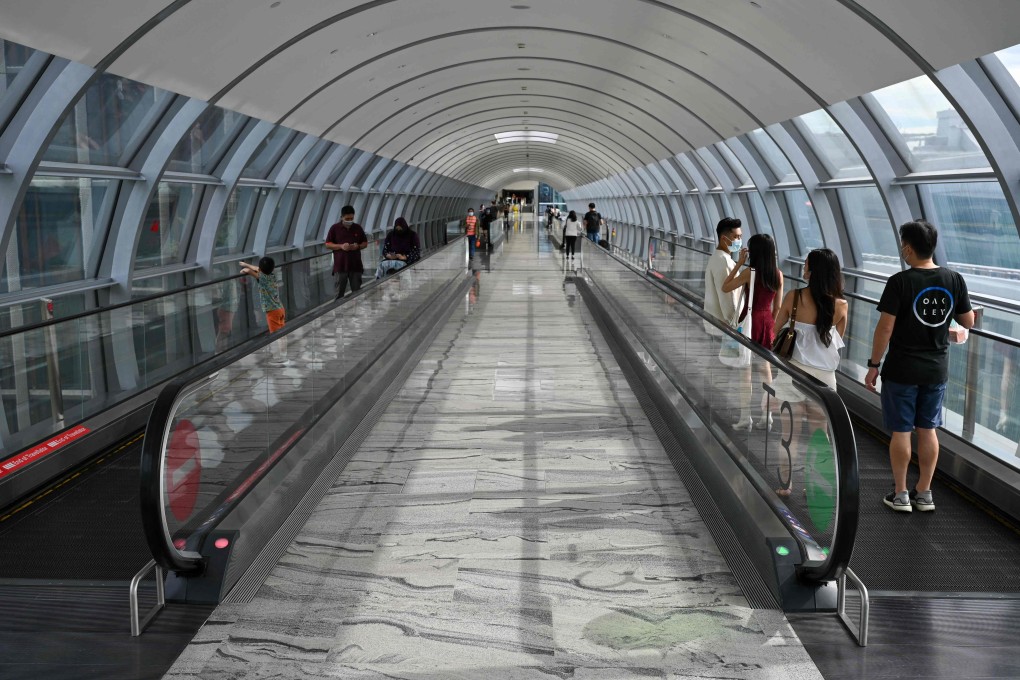 Travellers at Changi Airport in Singapore. Photo: AFP