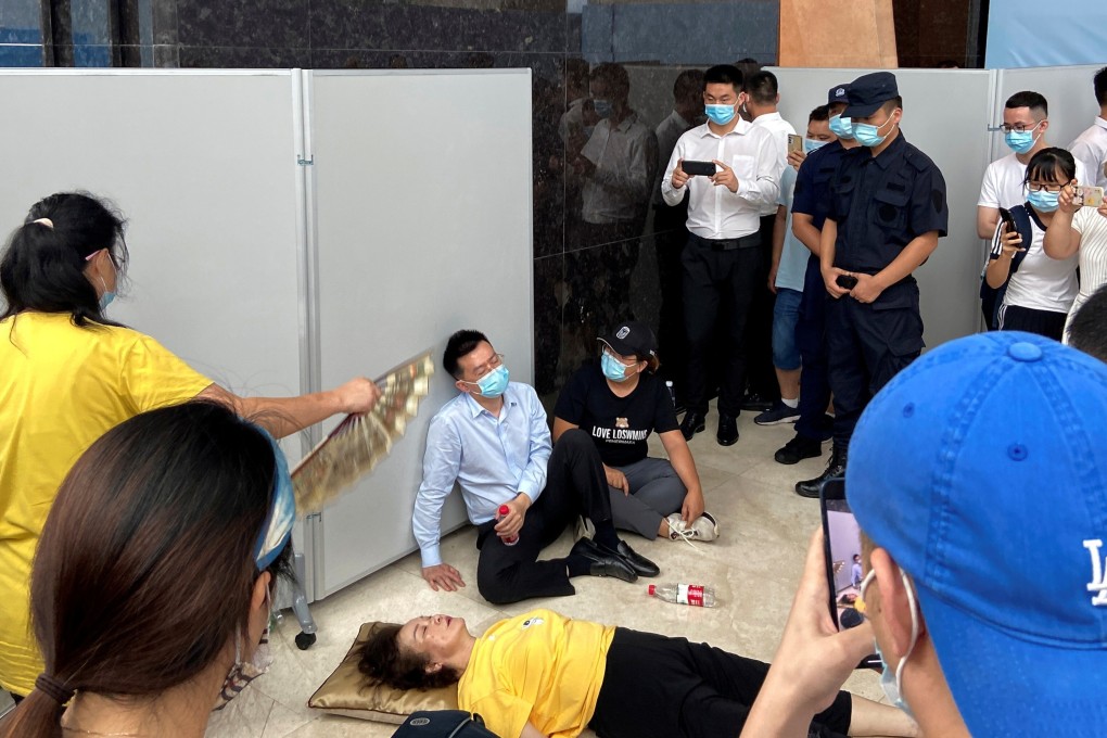 Customers of China Evergrande Group’s wealth management financial products staged a protest at the company’s Shenzhen head office on September 14, 2021 to demand their money back, amid concerns over the company’s financial health. Photo: Reuters.