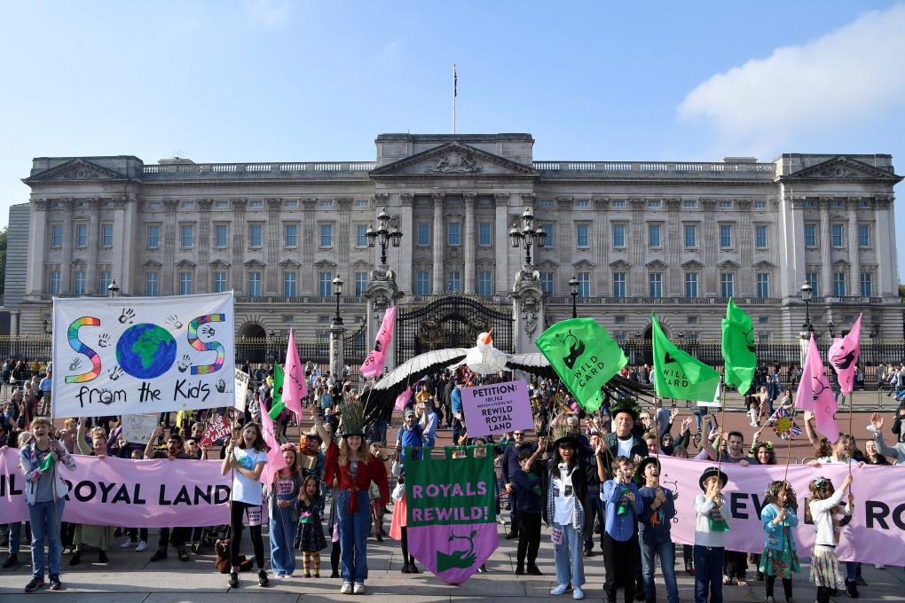Environmental campaigners take part in a march and delivery of a petition to Buckingham Palace in London on Saturday, demanding that the British royal family rewild their land. Photo: Reuters