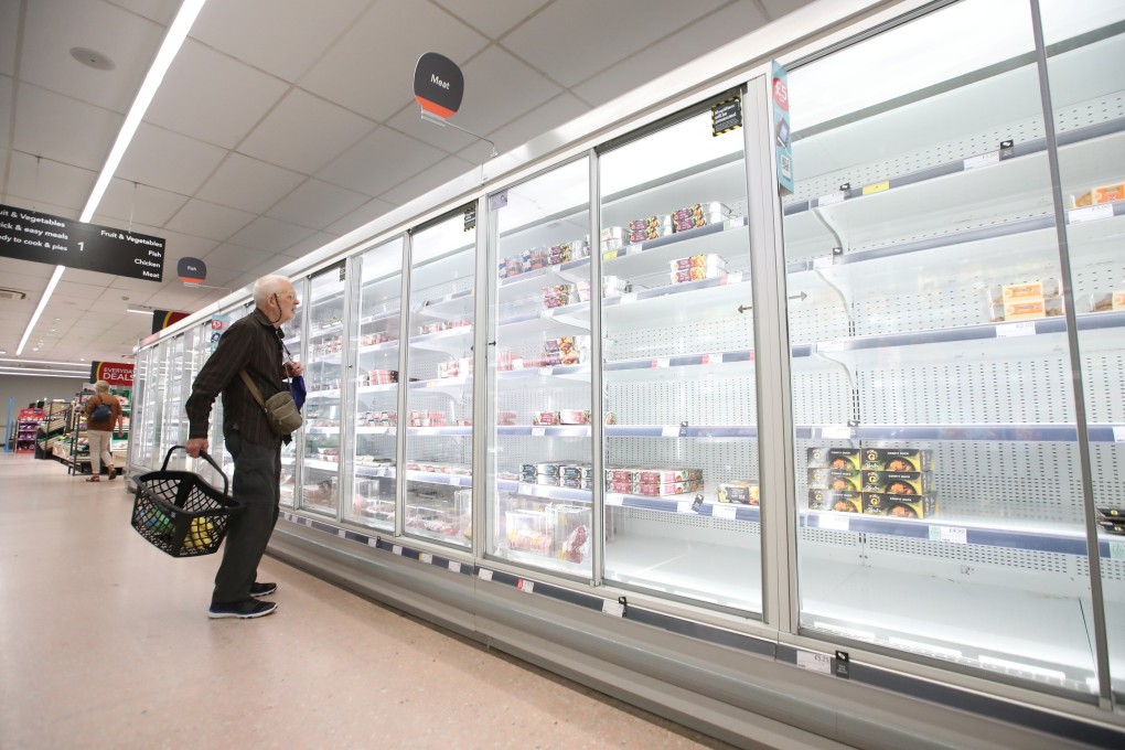 A shopper looks at produce and empty shelves of the meat aisle in co-op supermarket, Harpenden, Britain, September 22, 2021. Photo: Reuters