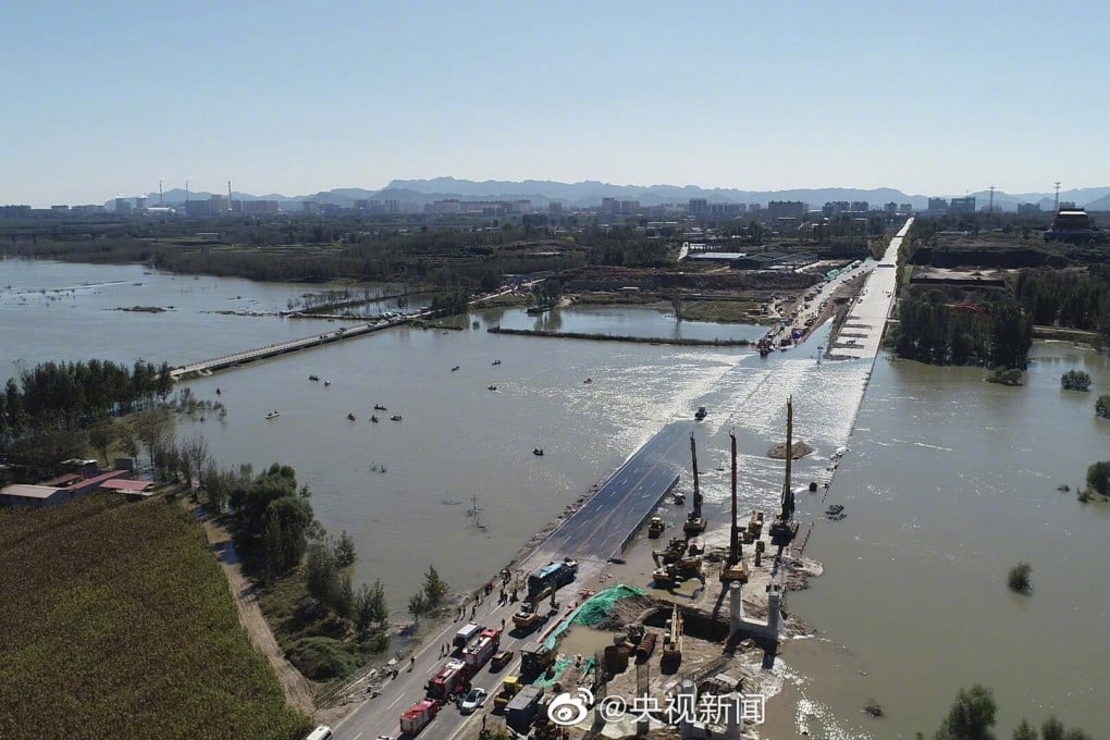 A bus carrying 51 people veered off Wangmu Bridge and into the Hutuo River on Monday. Photo: CCTV
