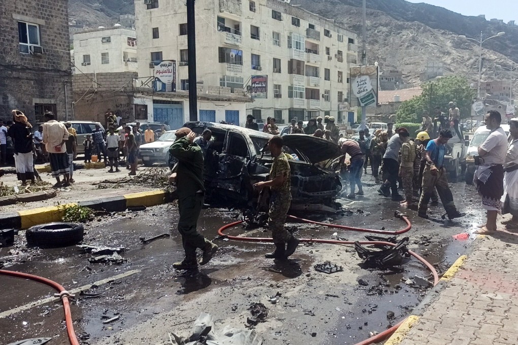Soldiers inspect the scene of a car-bomb attack which targeted a convoy of government officials in the city of Aden, Yemen on Sunday. Photo: EPA-EFE