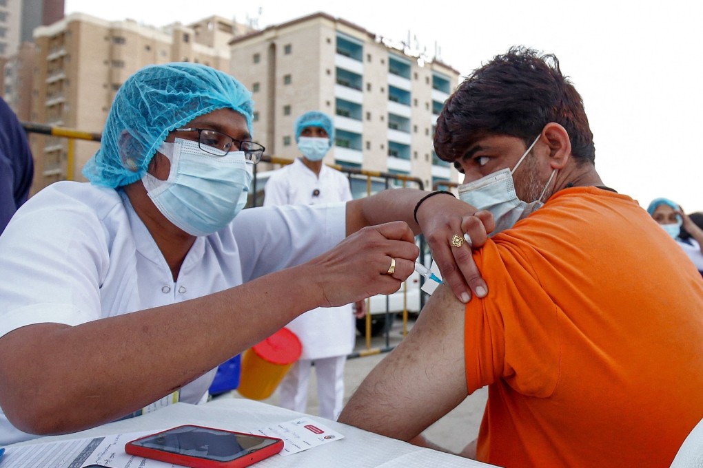 A man receives a Covid-19 vaccine shot in Kuwait City. Photo: AFP