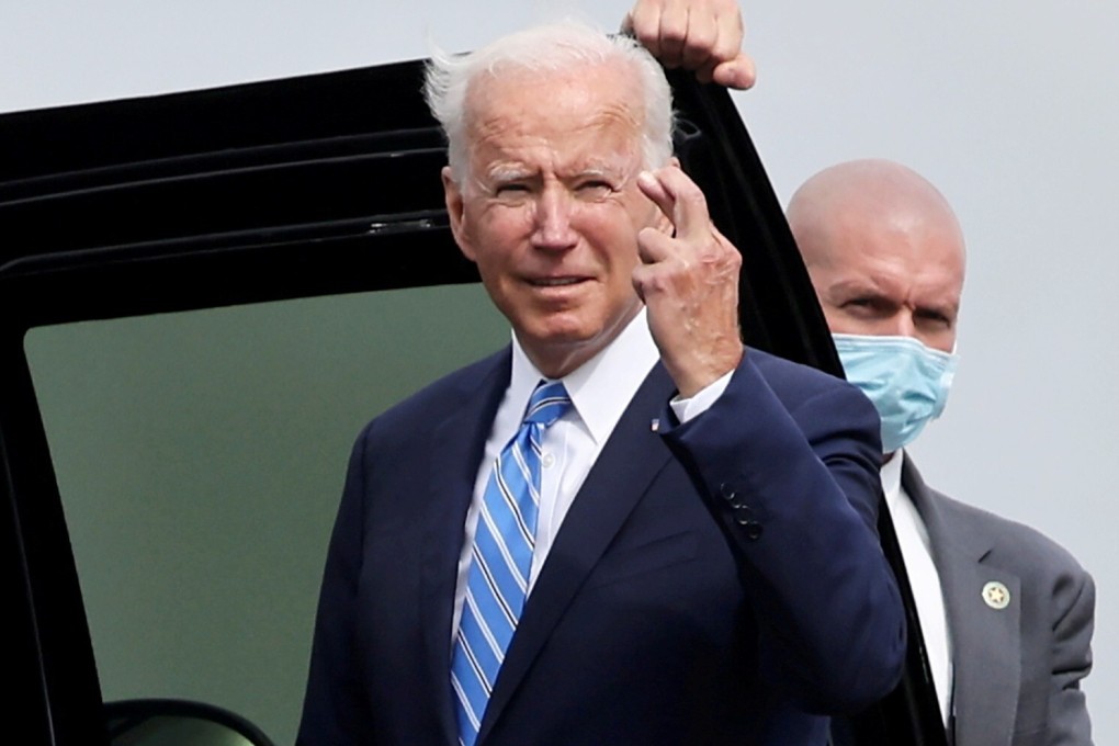 US President Joe Biden crosses his fingers as he responds to a question on October 7 about the short term US debt deal. Photo: Reuters