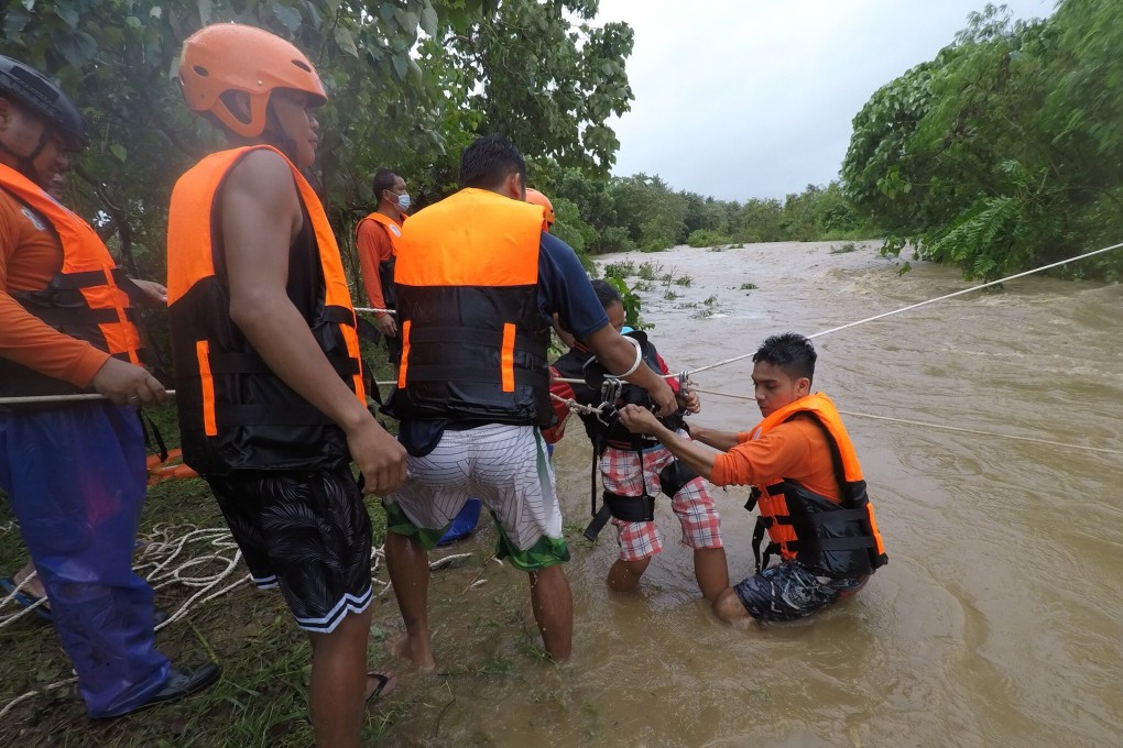 Rescuers at a flooded village in the town of Gonzaga, Cagayan province. Photo: EPA