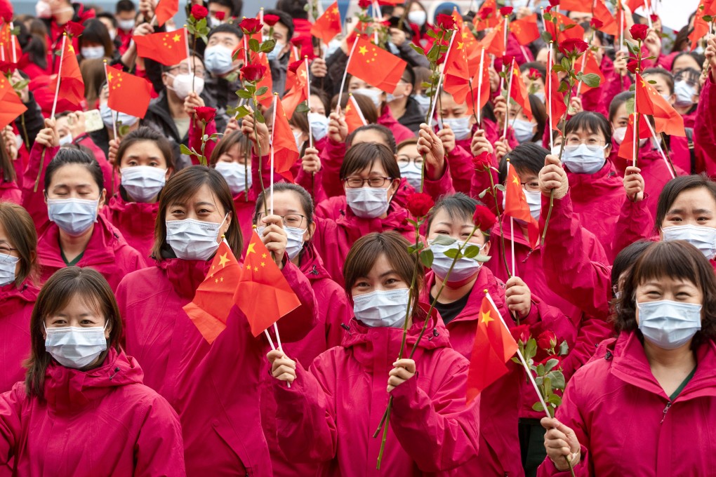 Medical workers from Jilin province take part in a farewell ceremony on Wednesday in Harbin, Heilongjiang, where they have been helping with mass testing during an outbreak in the city. Photo: Xinhua