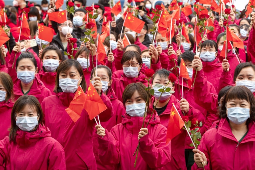 Medical workers from Jilin province take part in a farewell ceremony on Wednesday in Harbin, Heilongjiang, where they have been helping with mass testing during an outbreak in the city. Photo: Xinhua