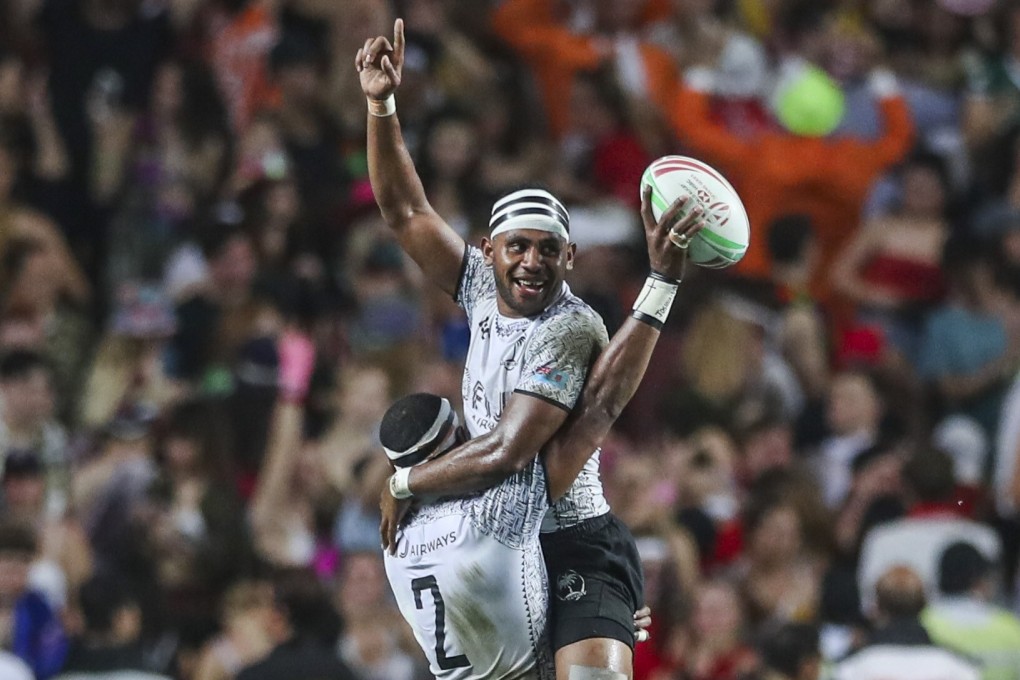 Vilimoni Botitu of Fiji is lifted up by his teammate Josua Vakurunabili after winning the Cup final match against France on the last day of the 2019 Hong Kong Sevens at Hong Kong Stadium. Photo: Sam Tsang