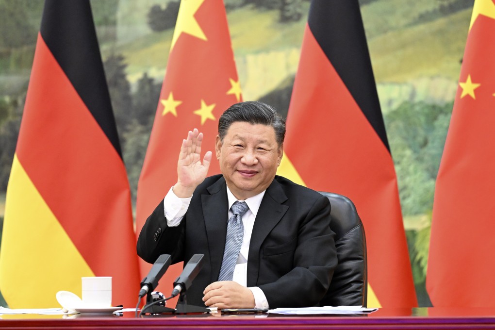 Chinese and German national flags form the backdrop as President Xi Jinping meets Chancellor Angela Merkel via video link from Beijing on Wednesday. Photo: Xinhua
