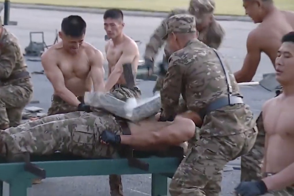 North Korean soldiers put on a martial arts show in front of leader Kim Jong-un at a military exhibition in Pyongyang. Photo: Video Capture
