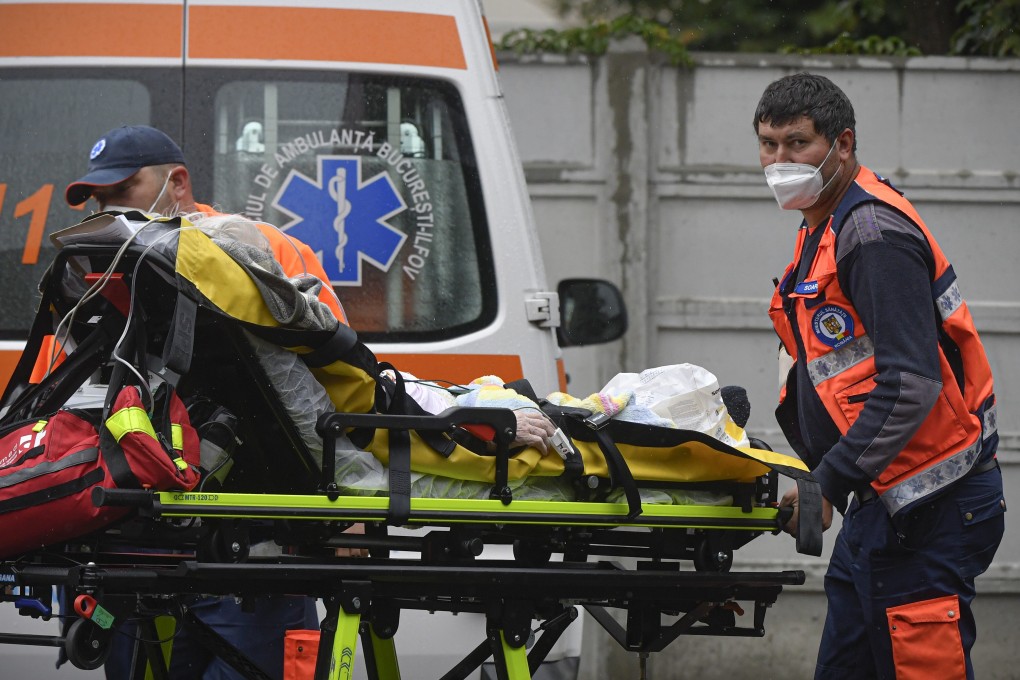 Paramedics bring an elderly patient to the emergency-room-turned-Covid-19-unit at a hospital in Bucharest, on Tuesday. Photo: AP