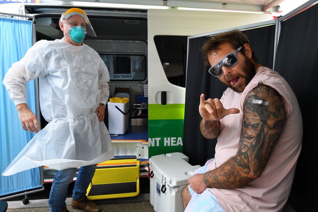 A man gestures after getting vaccinated against Covid19 in Melbourne, Australia. Photo: EPA-EFE