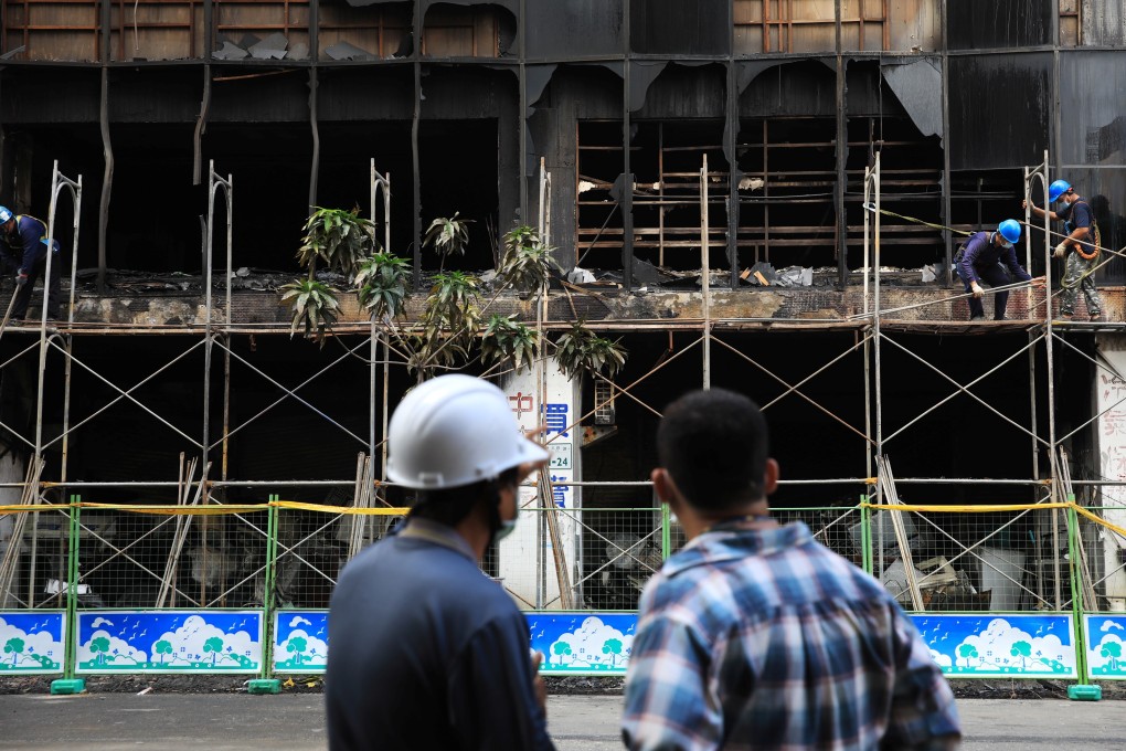 Scaffolding is put up at the fire damaged Cheng Chung Cheng building in Kaohsiung, Taiwan, on Friday. Photo: Reuters