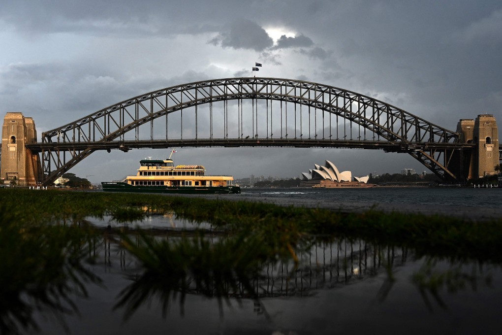 A ferry makes its way across the harbour in Sydney on Thursday. Photo: AFP