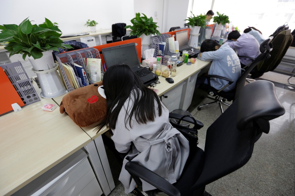 Employees at a fintech startup in Beijing take a rest at work. Photo: Reuters