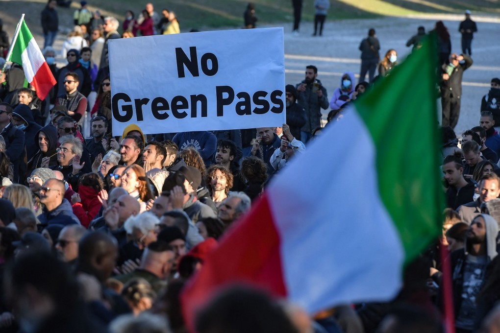 People gather during a protest against Italy’s green pass at the Circus Maximus in Rome on Friday. Photo: AFP