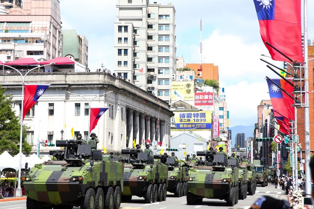 Military tanks pass in front of the Presidential Office during the National Day celebration in Taipei. Photo: Bloomberg