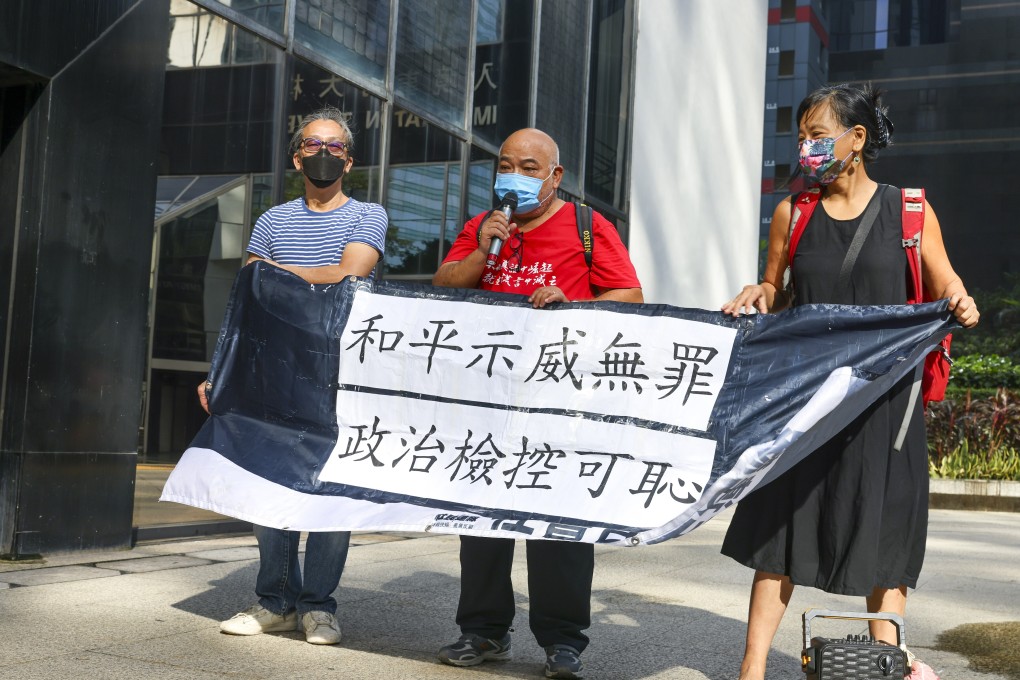 Former district councillor Tsang Kin-shing, 65, argues outside District Court that peaceful demonstrations should not be illegal outside before his sentencing on Saturday. Photo: Dickson Lee