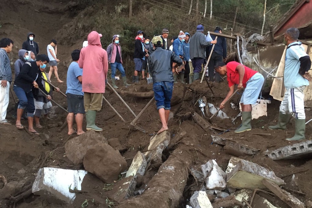 People search debris near a quake-hit house in Bangli, Bali. Photo: Bali BPBD/EPA-EFE
