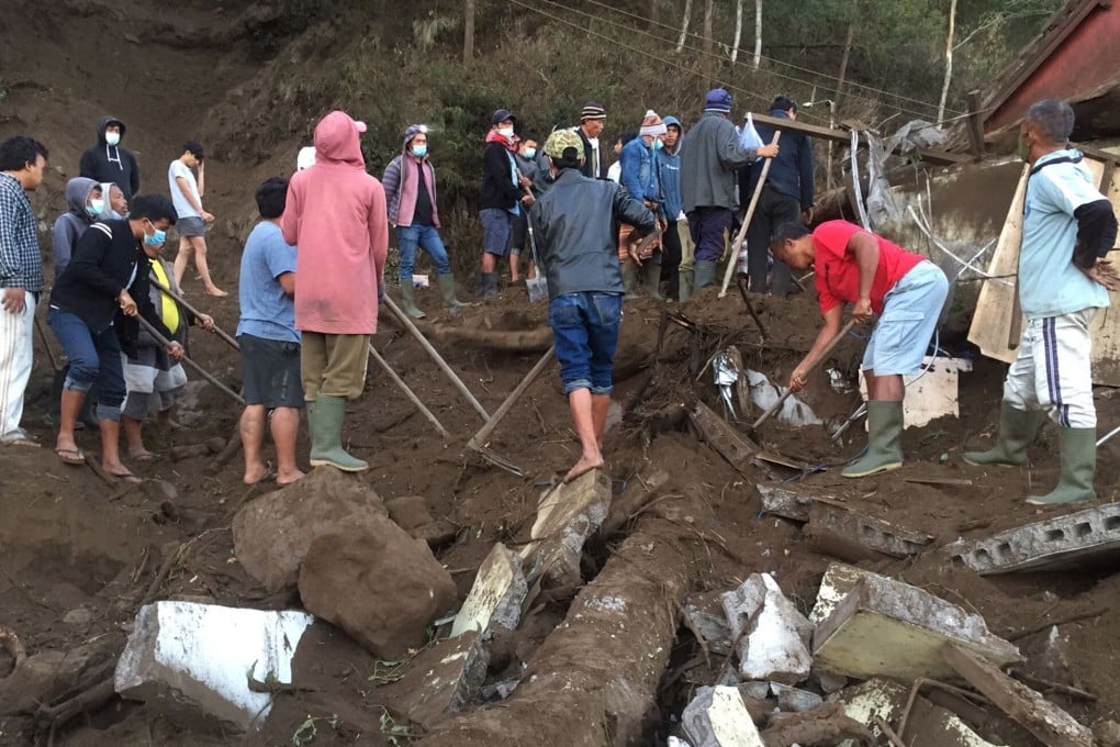 People search debris near a quake-hit house in Bangli, Bali. Photo: Bali BPBD/EPA-EFE
