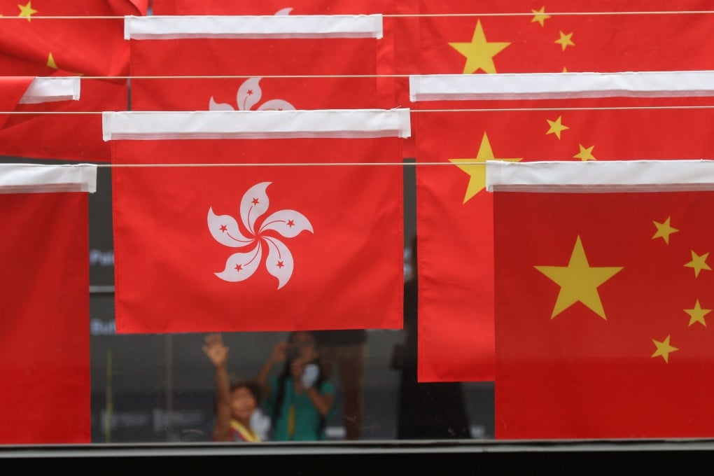 The Hong Kong flag (left) flies alongside the Chinese flag. Photo: Dickson Lee