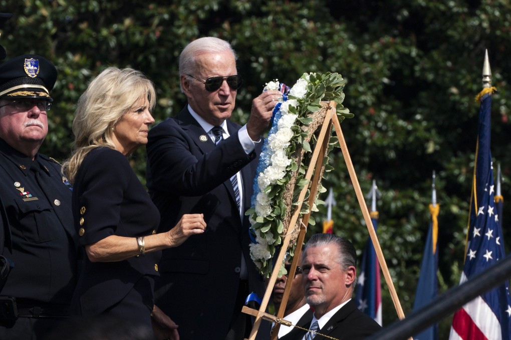 US President Joe Biden and Jill Biden place flowers on a wreath during a ceremony honouring fallen police officers at the National Peace Officers’ Memorial Service at the Capitol in Washington on Saturday. Photo: AP