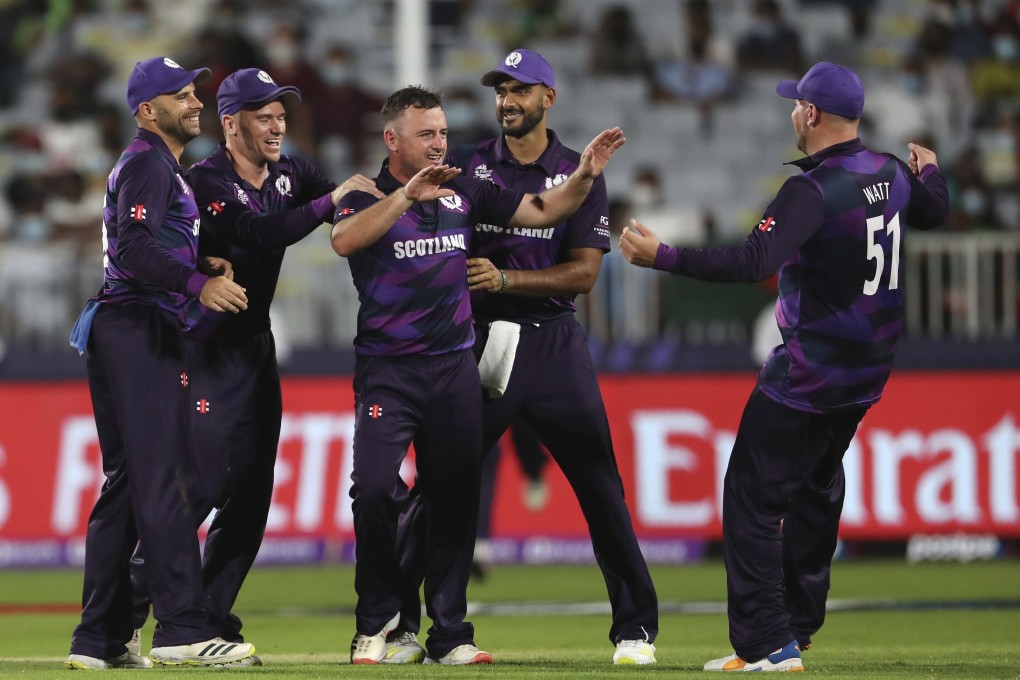 Scotland’s Chris Greaves takes the plaudits after taking a wicket against Bangladesh in Muscat, Oman. Photo: AP
