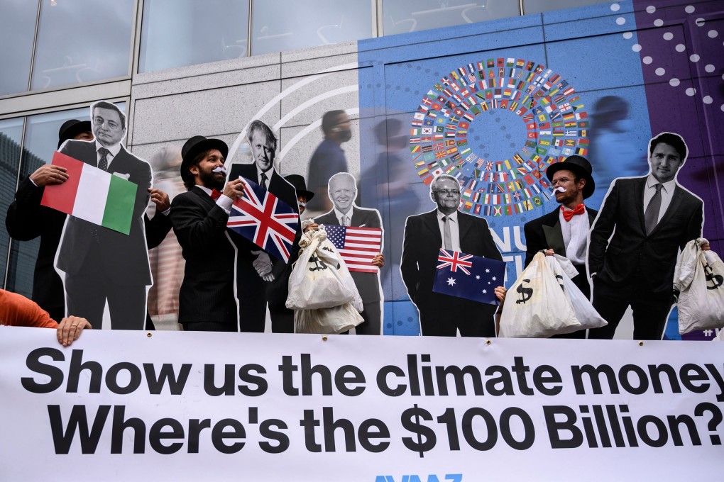 Activists demonstrate in front of the IMF headquarters in Washington on October 13, as they urged rich nations to keep their commitment to help tackle climate change. Photo: AFP